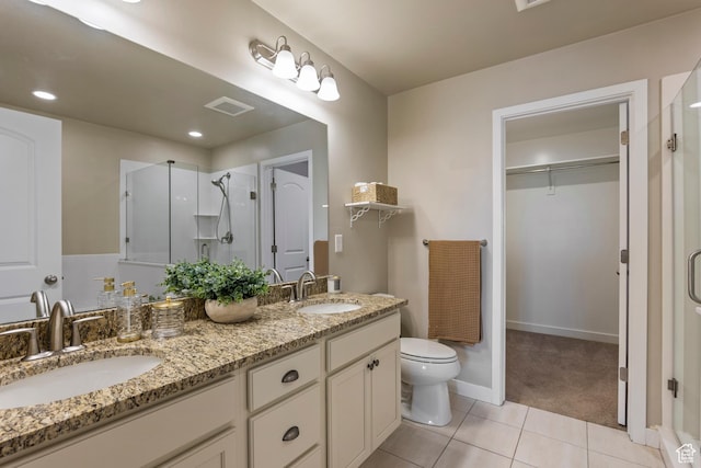 10572 S Kestrel Rise Rd, South Jordan, UT 84009 - full bathroom featuring a shower stall, tile patterned floors, double vanity, a walk in closet, and recessed lighting