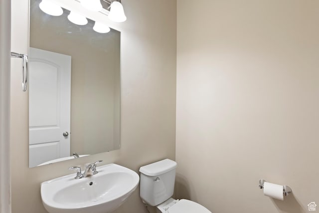 10572 S Kestrel Rise Rd, South Jordan, UT 84009 - half bathroom featuring a sink and toilet