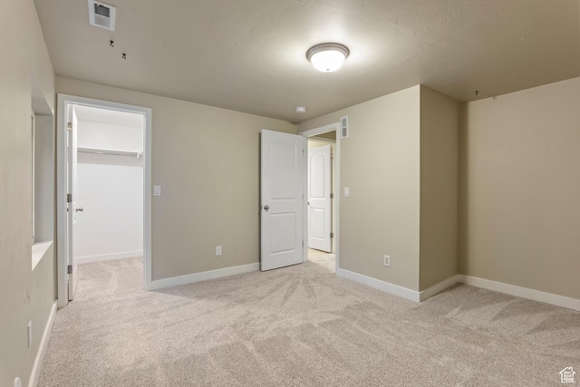 10572 S Kestrel Rise Rd, South Jordan, UT 84009 - unfurnished bedroom with light colored carpet, a spacious closet, and a closet