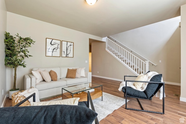 10572 S Kestrel Rise Rd, South Jordan, UT 84009 - living area with stairway and wood finished floors