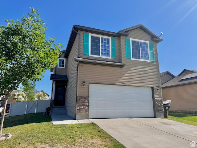 2061 Revere Way, Eagle Mountain, UT 84005 - view of front of property featuring an attached garage, concrete driveway, and stone siding
