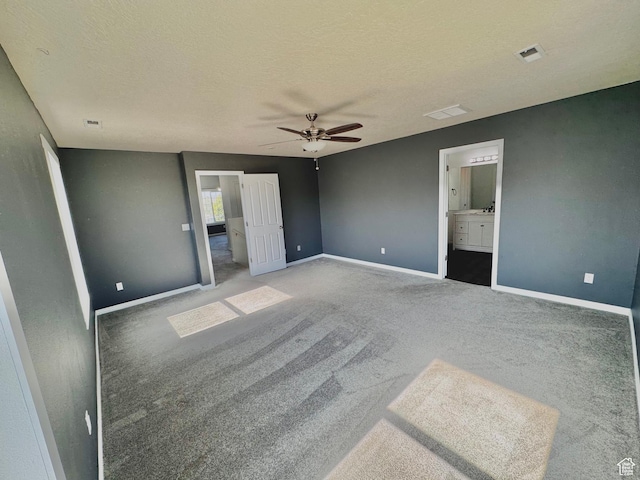 2061 Revere Way, Eagle Mountain, UT 84005 - unfurnished bedroom with carpet, a textured ceiling, ensuite bath, and a ceiling fan