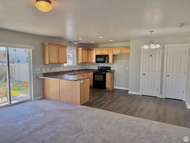 2061 Revere Way, Eagle Mountain, UT 84005 - kitchen featuring black appliances, dark countertops, dark colored carpet, backsplash, and a chandelier