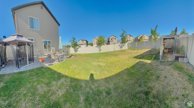 2061 Revere Way, Eagle Mountain, UT 84005 - fenced backyard with a gazebo, a residential view, and a patio