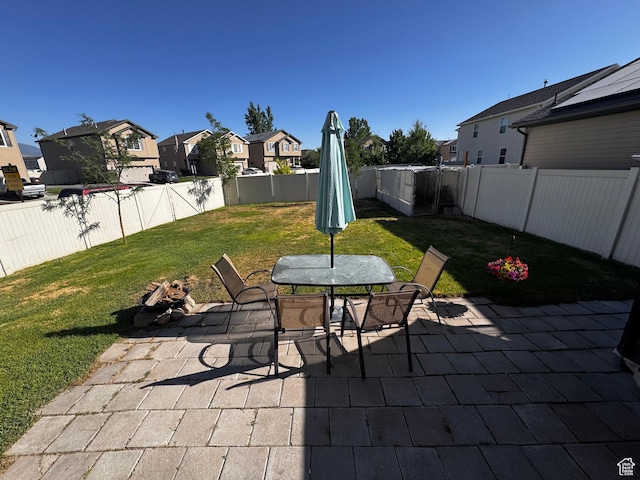 2061 Revere Way, Eagle Mountain, UT 84005 - fenced backyard with a residential view, a patio, and outdoor dining area