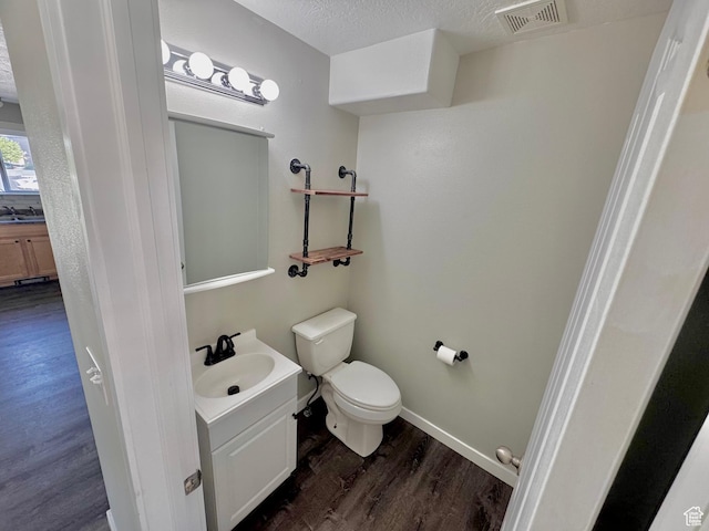 2061 Revere Way, Eagle Mountain, UT 84005 - half bath featuring wood finished floors, vanity, and a textured ceiling