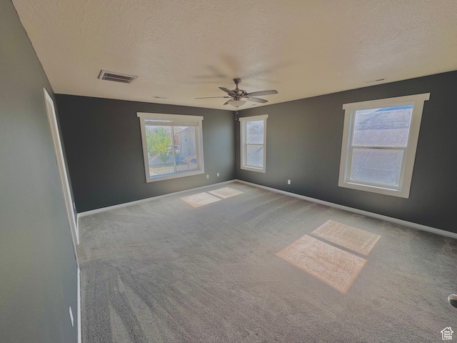 2061 Revere Way, Eagle Mountain, UT 84005 - spare room with a textured ceiling, carpet flooring, and a ceiling fan