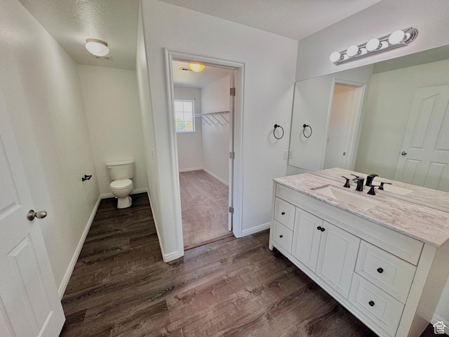 2061 Revere Way, Eagle Mountain, UT 84005 - bathroom with wood finished floors, vanity, and a spacious closet