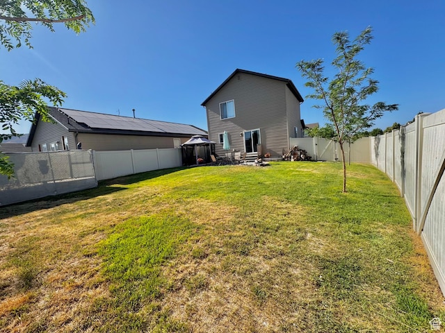 2061 Revere Way, Eagle Mountain, UT 84005 - back of house with a gazebo and a fenced backyard
