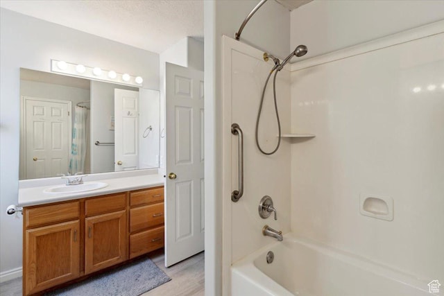 801 W Harrisville Rd N Unit 14, Ogden, UT 84404 - full bath with shower / bath combo with shower curtain, vanity, and wood finished floors