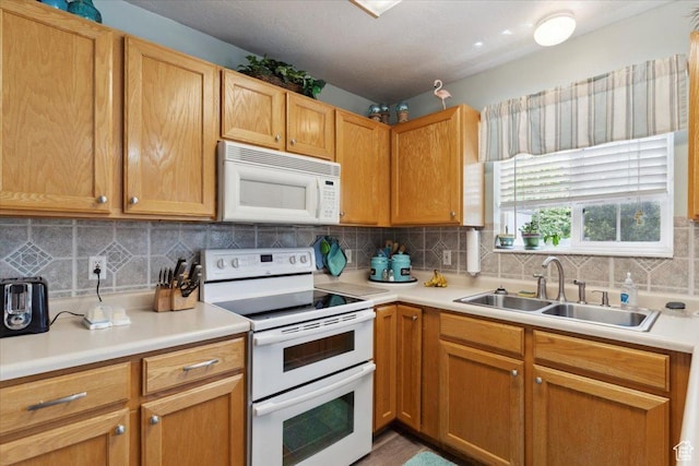 801 W Harrisville Rd N Unit 14, Ogden, UT 84404 - kitchen featuring white appliances, light countertops, and tasteful backsplash