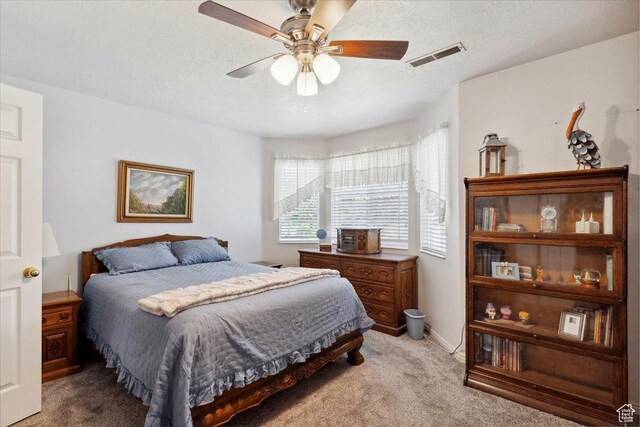 801 W Harrisville Rd N Unit 14, Ogden, UT 84404 - bedroom with light carpet, a textured ceiling, and a ceiling fan