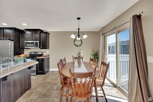 14483 S Ryegate Dr, Herriman, UT 84096 - dining area with recessed lighting, a chandelier, and light stone finish flooring