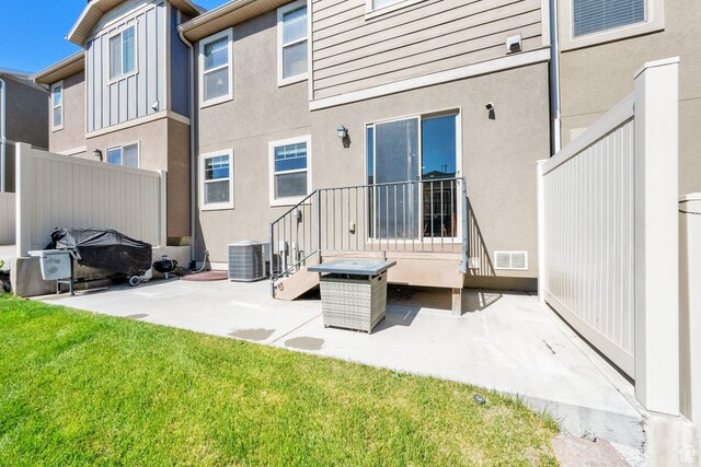 14483 S Ryegate Dr, Herriman, UT 84096 - back of house featuring a patio area, stucco siding, and a yard