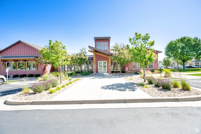 14483 S Ryegate Dr, Herriman, UT 84096 - view of front of house featuring french doors and board and batten siding