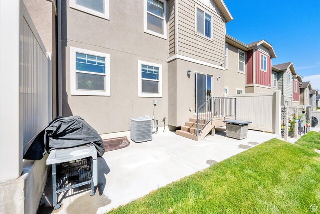 14483 S Ryegate Dr, Herriman, UT 84096 - rear view of property with a residential view, a patio, and stucco siding