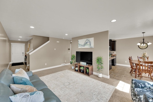 14483 S Ryegate Dr, Herriman, UT 84096 - living room with light carpet, a chandelier, recessed lighting, and stairs