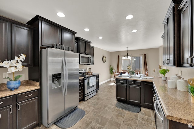14483 S Ryegate Dr, Herriman, UT 84096 - kitchen with stainless steel appliances, recessed lighting, a peninsula, light countertops, and hanging light fixtures