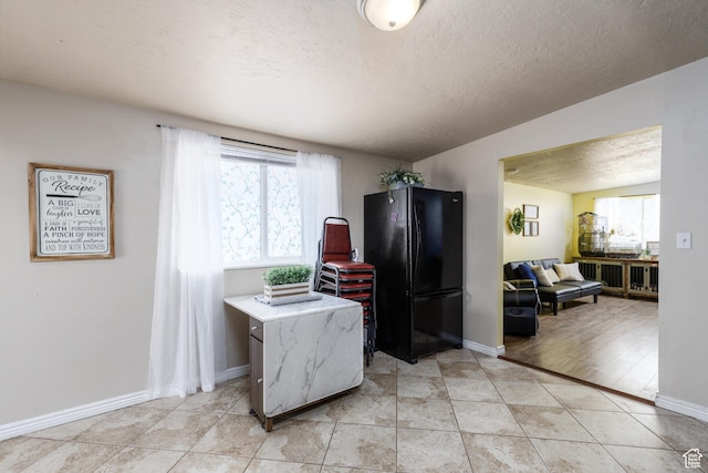 720 E 850 N, Ogden, UT 84404 - kitchen featuring freestanding refrigerator, a textured ceiling, and light countertops
