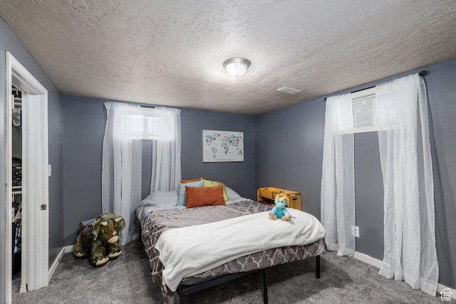 720 E 850 N, Ogden, UT 84404 - carpeted bedroom with a textured ceiling and baseboards