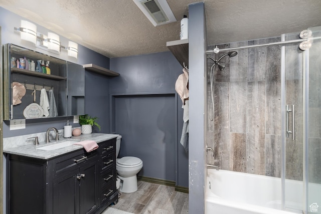 720 E 850 N, Ogden, UT 84404 - bathroom featuring wood finished floors, vanity, shower / bath combination, and a textured ceiling