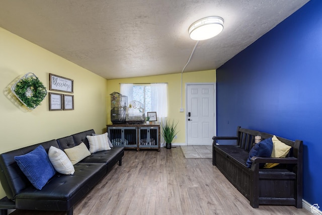 720 E 850 N, Ogden, UT 84404 - living area featuring a textured ceiling, wood finished floors, and lofted ceiling
