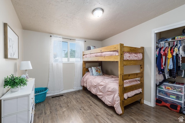 720 E 850 N, Ogden, UT 84404 - bedroom with a textured ceiling, wood finished floors, and a closet