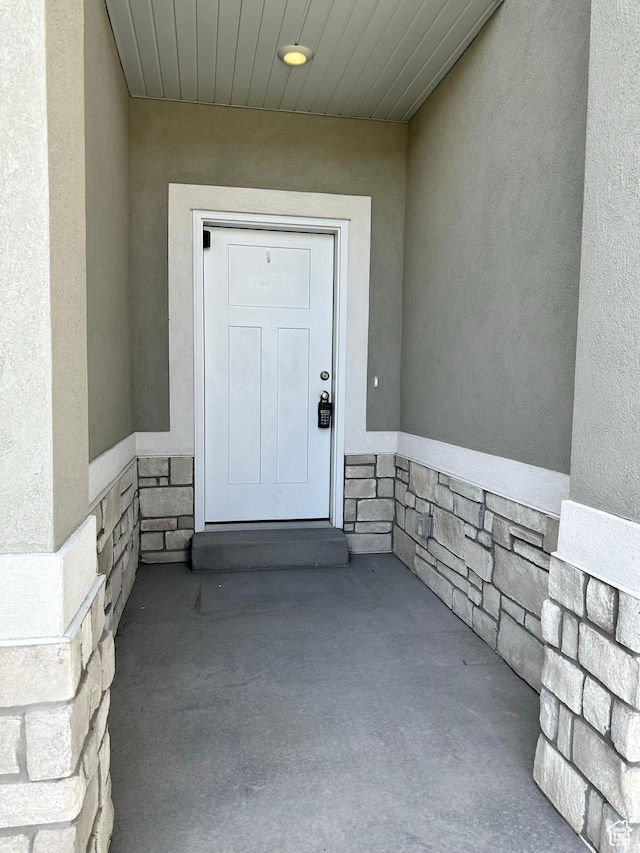 849 N Gleneagles Ct W, Tooele, UT 84074 - doorway to property with stucco siding and stone siding