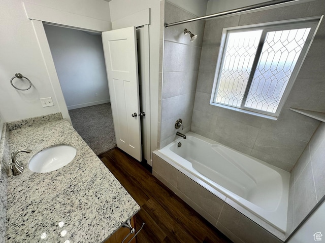 849 N Gleneagles Ct W, Tooele, UT 84074 - full bath featuring wood finished floors, vanity, and tiled shower / bath combo