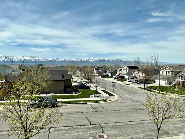 849 N Gleneagles Ct W, Tooele, UT 84074 - view of asphalt street featuring a residential view, a mountain view, and curbs