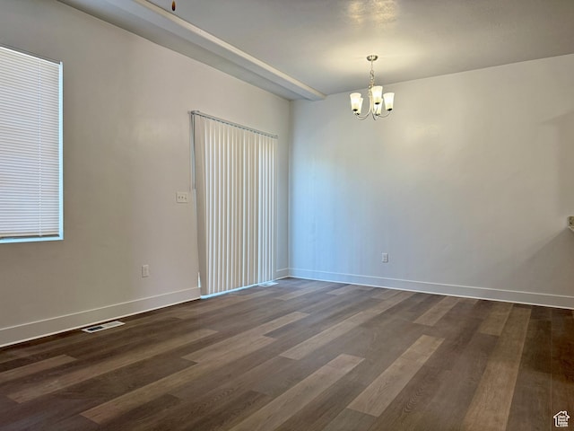 849 N Gleneagles Ct W, Tooele, UT 84074 - unfurnished room with a chandelier and dark wood finished floors