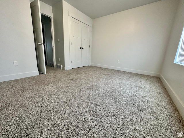 849 N Gleneagles Ct W, Tooele, UT 84074 - unfurnished bedroom with a closet and carpet floors