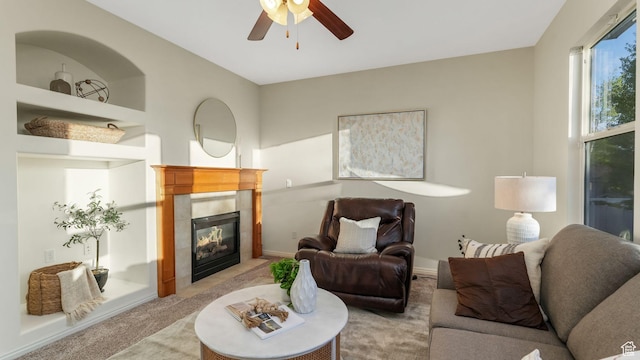 1562 S 910 W, Payson, UT 84651 - living room featuring light carpet, a tiled fireplace, and ceiling fan
