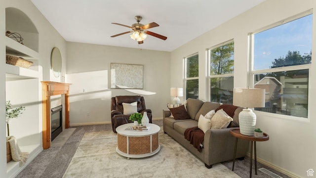 1562 S 910 W, Payson, UT 84651 - living room with light carpet, a glass covered fireplace, and ceiling fan