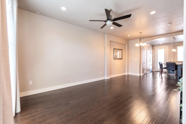 11463 S Lake Run Rd W, South Jordan, UT 84009 - unfurnished living room featuring dark wood-style flooring, a chandelier, ceiling fan, and recessed lighting