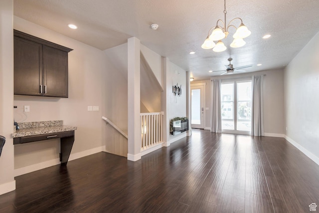 11463 S Lake Run Rd W, South Jordan, UT 84009 - unfurnished living room with a chandelier, dark wood-style flooring, a textured ceiling, and recessed lighting