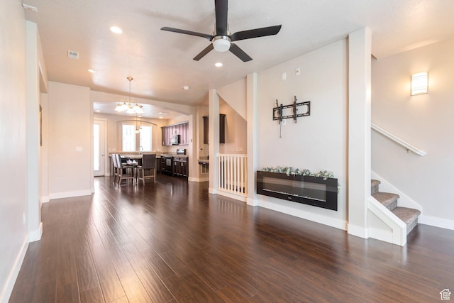 11463 S Lake Run Rd W, South Jordan, UT 84009 - living area featuring a chandelier, dark wood-style floors, ceiling fan, stairs, and recessed lighting