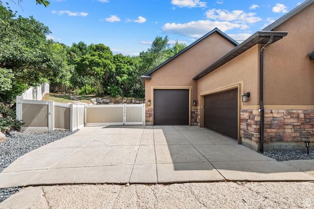 520 Lacey Way N, Salt Lake, UT 84054 - garage with driveway and a gate