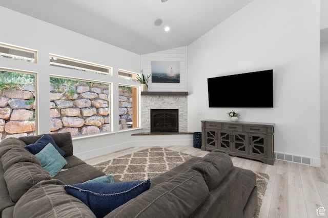 520 Lacey Way N, Salt Lake, UT 84054 - living area featuring wood finished floors, a stone fireplace, and high vaulted ceiling