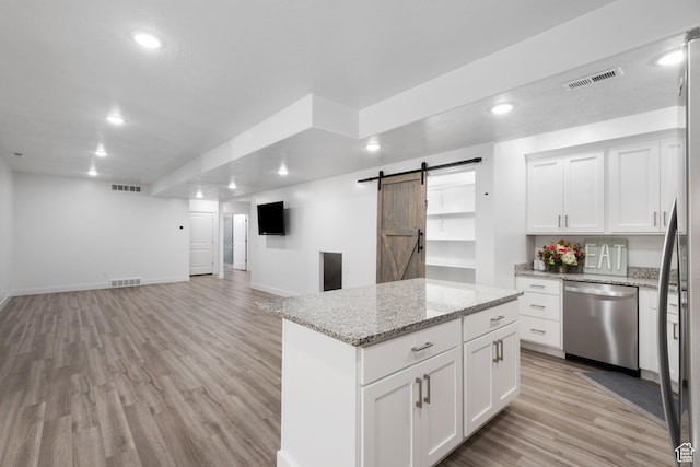 520 Lacey Way N, Salt Lake, UT 84054 - kitchen with stainless steel dishwasher, a barn door, open floor plan, light wood finished floors, and recessed lighting