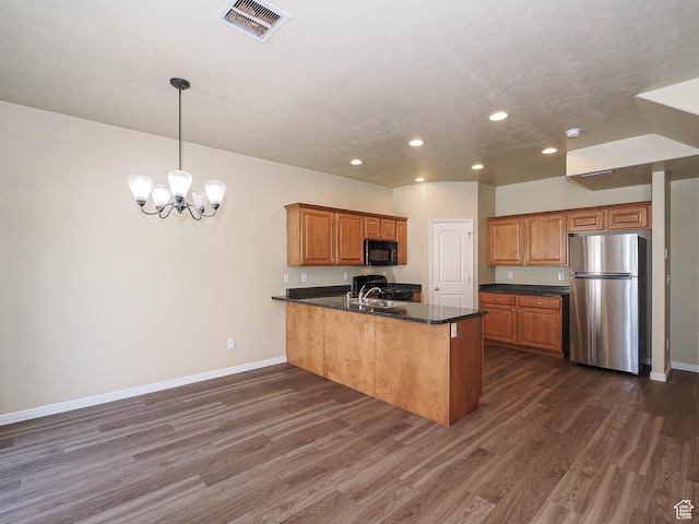 6900 S Village Haven Ln W, Midvale, UT 84047 - kitchen featuring freestanding refrigerator, black microwave, a peninsula, recessed lighting, and dark wood-style floors
