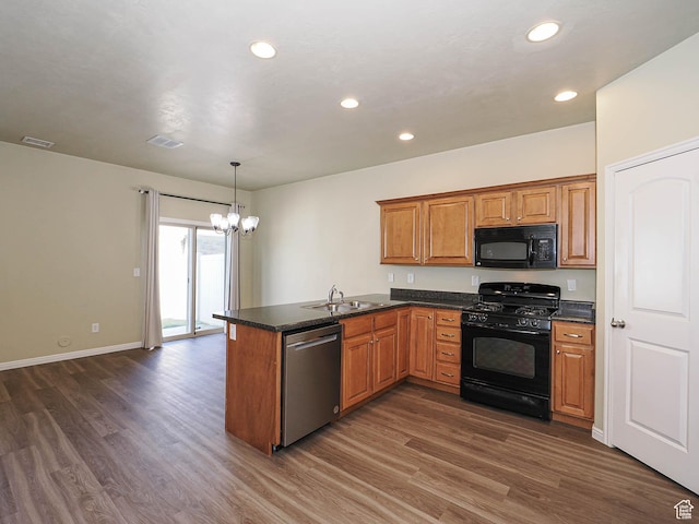 6900 S Village Haven Ln W, Midvale, UT 84047 - kitchen featuring black appliances, a chandelier, a peninsula, dark wood finished floors, and brown cabinetry