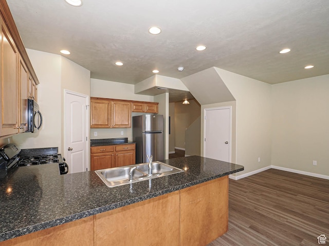 6900 S Village Haven Ln W, Midvale, UT 84047 - kitchen with freestanding refrigerator, black gas range oven, recessed lighting, a peninsula, and dark wood-type flooring