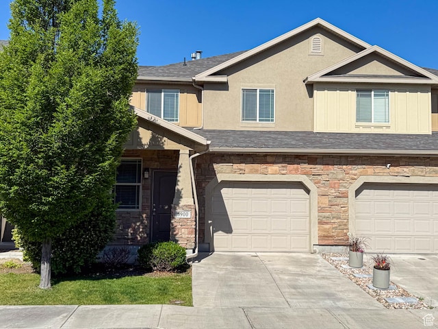 6900 S Village Haven Ln W, Midvale, UT 84047 - multi unit property with stone siding, driveway, stucco siding, and an attached garage
