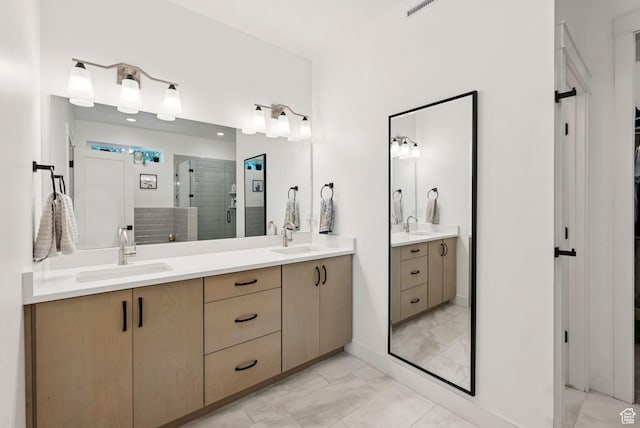 520 S Orchard Dr Unit 1, Bountiful, UT 84010 - bathroom featuring marble finish floors, double vanity, and a stall shower