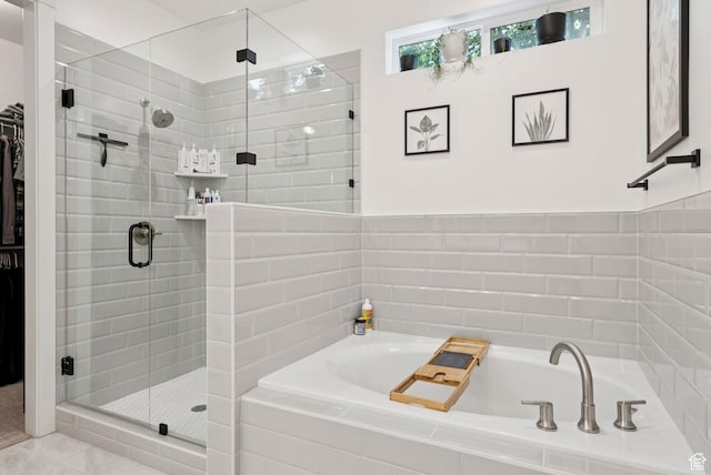 520 S Orchard Dr Unit 1, Bountiful, UT 84010 - full bathroom featuring a bath, a shower stall, and a spacious closet