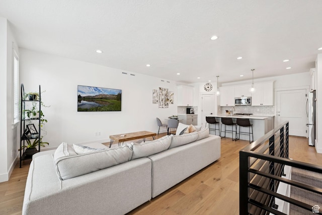 520 S Orchard Dr Unit 1, Bountiful, UT 84010 - living area with recessed lighting and light wood-style floors