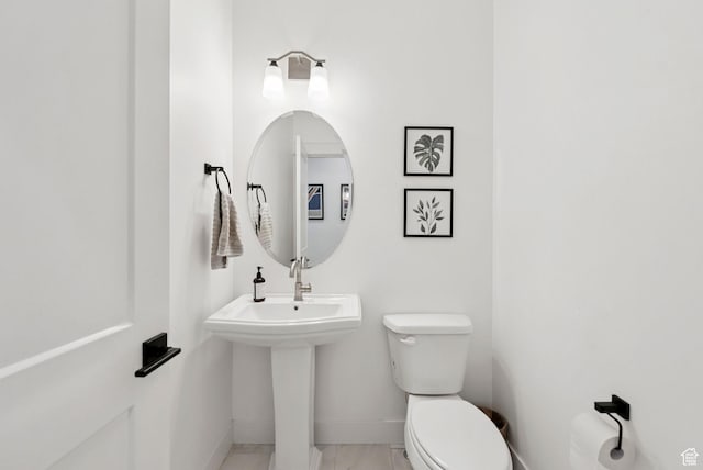 520 S Orchard Dr Unit 1, Bountiful, UT 84010 - half bathroom with baseboards and toilet