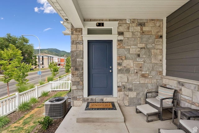 520 S Orchard Dr Unit 1, Bountiful, UT 84010 - view of exterior entry featuring stone siding and a mountain view