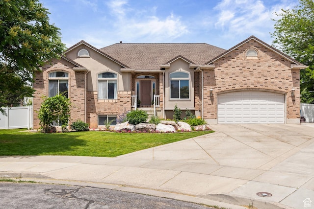 3863 S 850 W, Riverdale, UT 84405 - view of front of home with concrete driveway, stucco siding, and brick siding